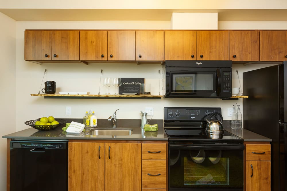 Kitchen with black appliances at Marvel 29 in Portland, Oregon