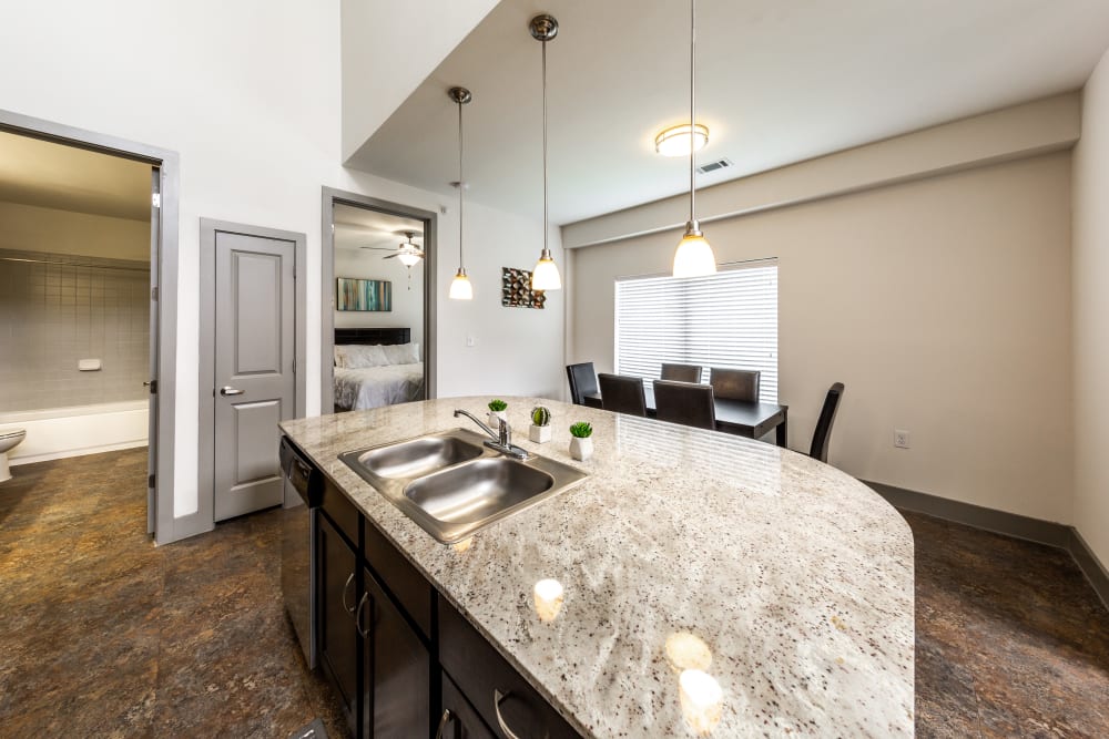 Kitchen with granite counters at Regents West at 26th in Austin, Texas