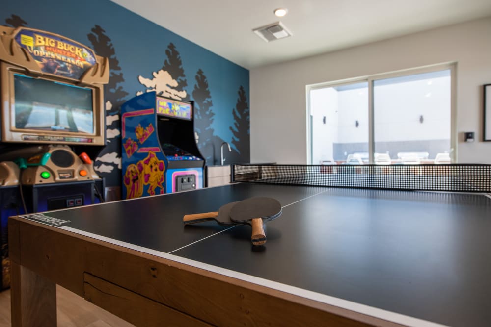 Ping pong table and arcade cabinets at Marq Iliff Station in Aurora, Colorado