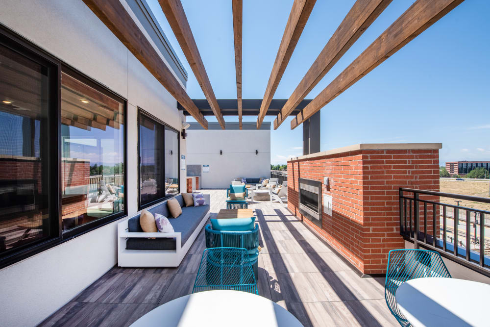 Rooftop lounge with fireplace at Marq Iliff Station in Aurora, Colorado