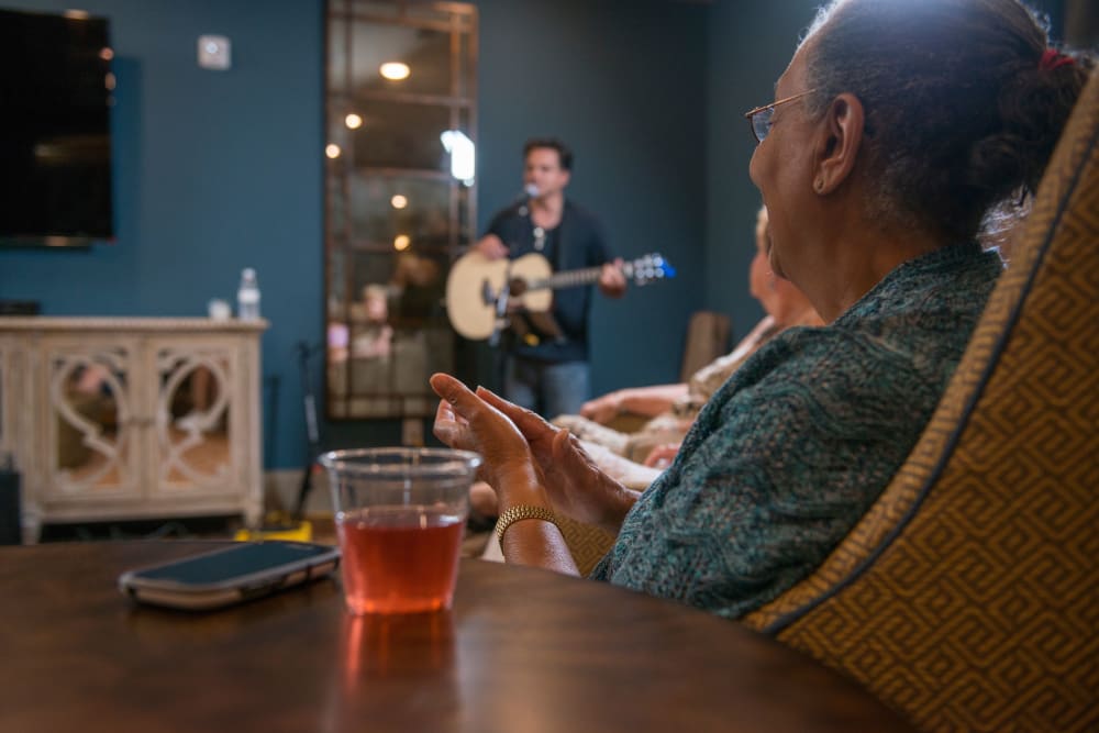 Resident enjoying music at The Reserve at Watermere Woodland Lakes in Conroe, Texas