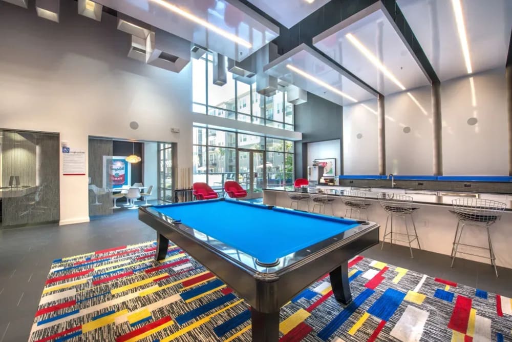 Gaming area in the clubhouse where they have a pool table at Macallan at Ross in Dallas, Texas