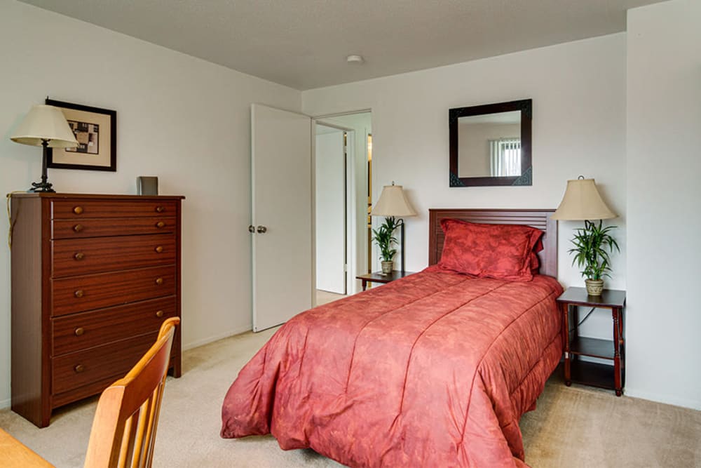 A cozy bedroom in a home at Briarcliffe Apartments & Townhomes in Lansing, Michigan