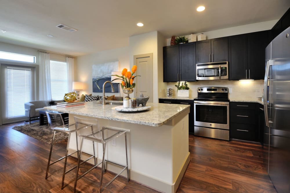Beautiful kitchen with island counter at Olympus Falcon Landing in Katy, Texas