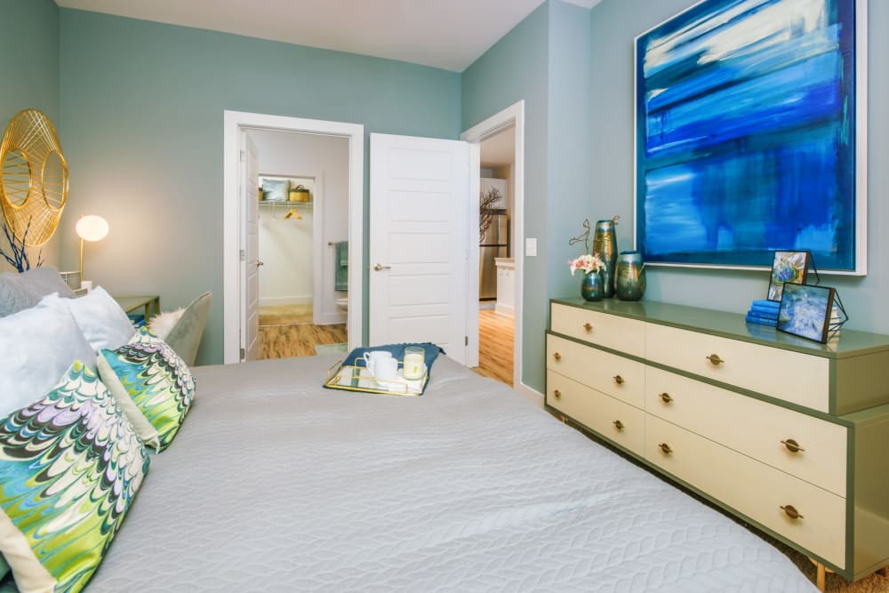 Large, well lit bedroom with carpeted floors at Blu at Northline Apartments in Charlotte, North Carolina