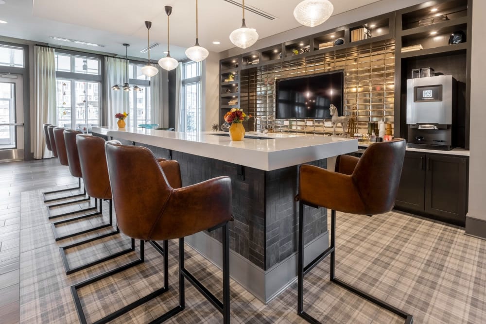 Tall bar area with lots of seats for residents to have coffee or drinks in at Parc at Murfreesboro in Murfreesboro, Tennessee