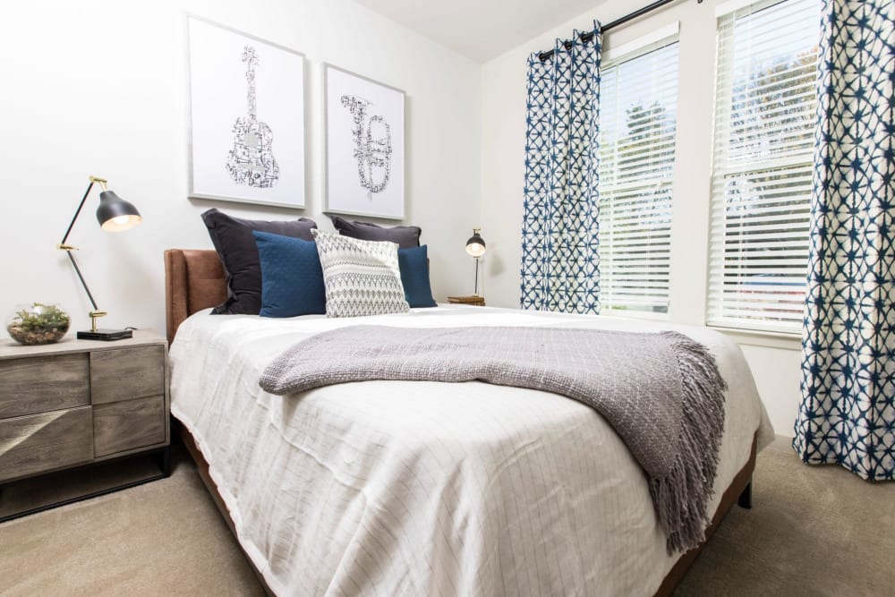 Beautifully decorated bedroom with tons of natural light at Parc at Murfreesboro in Murfreesboro, Tennessee