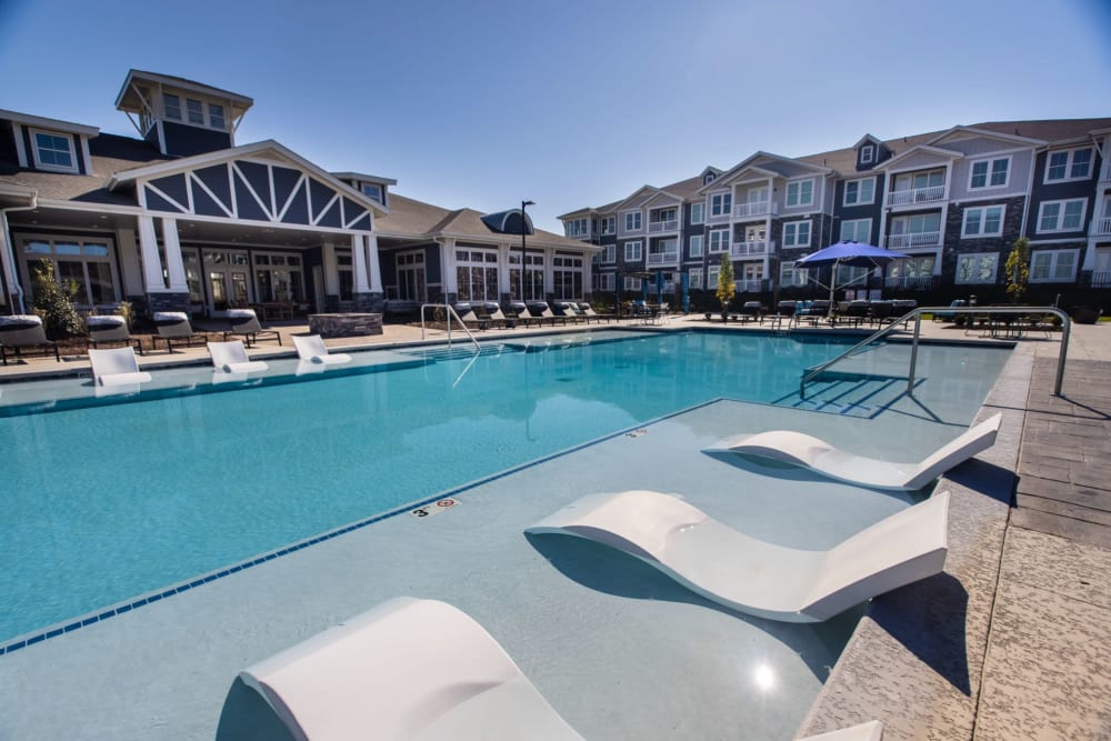 Lounge chairs in the water so you can swim up and relax at Parc at Murfreesboro in Murfreesboro, Tennessee
