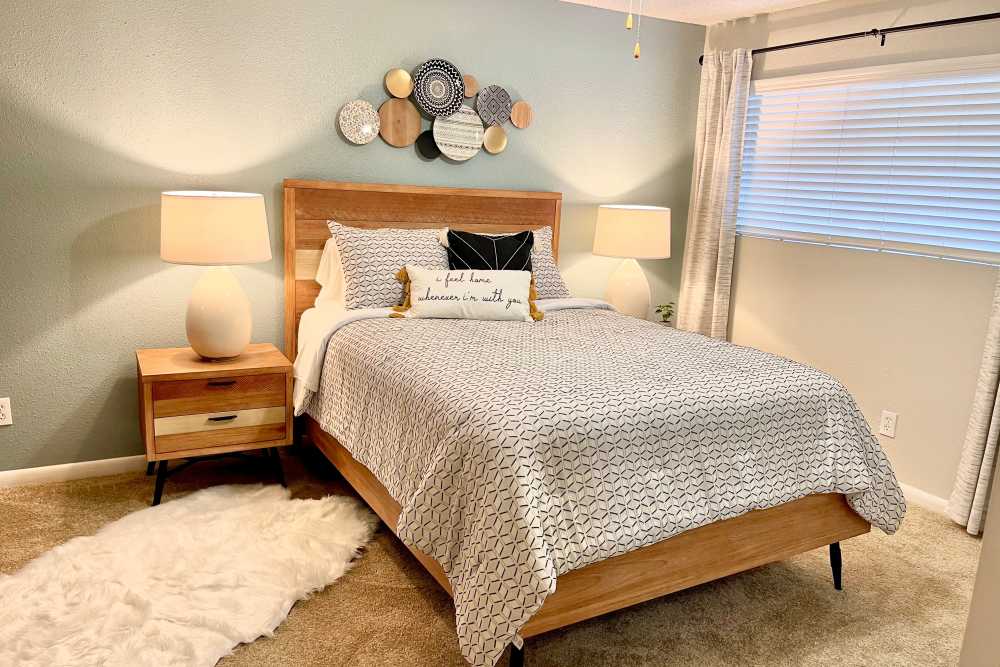 Spacious bedroom with large bed and cabinetry at The Abbey at Briargrove Park in Houston, Texas