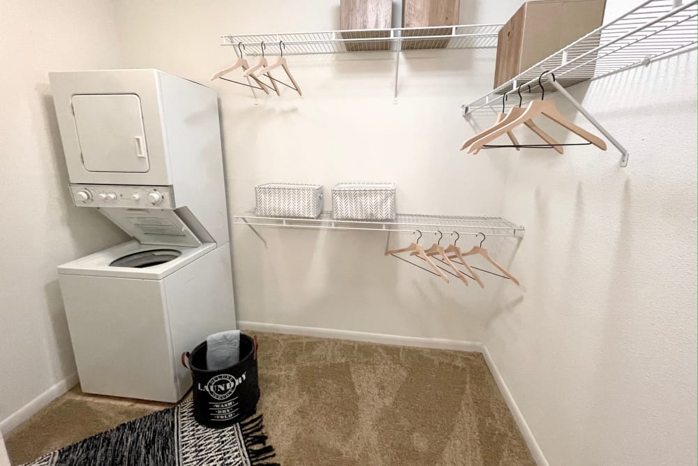 Walk-in closet with a washer & dryer at The Abbey at Briargrove Park in Houston, Texas