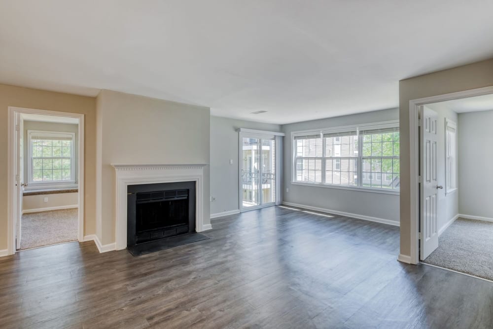 Upgraded living room with fireplace at Abbotts Run Apartments in Alexandria, Virginia