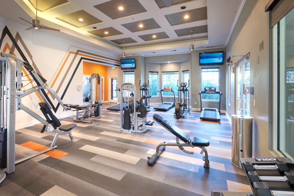 Fitness center with plenty of individual workout stations at Legend Oaks Apartments in Aurora, Colorado