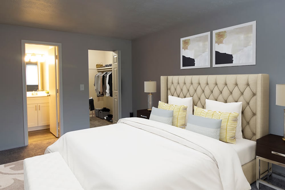 Model bedroom with walk-in closet and ensuite bathroom at Park Place of South Park in South Park, Pennsylvania