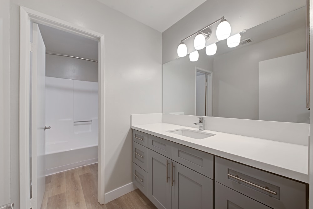Updated bathroom with oversized vanity and a tub/shower combination at Sofi Ventura in Ventura, California