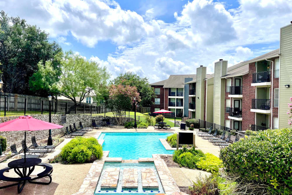 Swimming pool with sun loungers at The Abbey at Medical Center in San Antonio, Texas