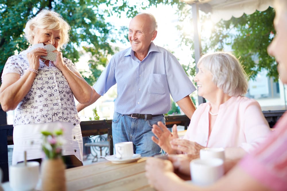 Residents playing cards at Holden of Bellevue in Bellevue, Washington