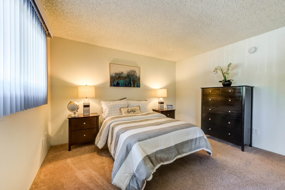 Spacious carpeted bedroom at Cypress Point in Northridge, CA