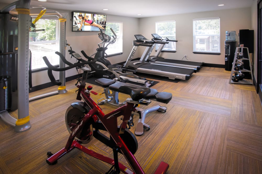 Spin bikes and cardio machines in the fitness center at Haven Apartment Homes in Kent, Washington