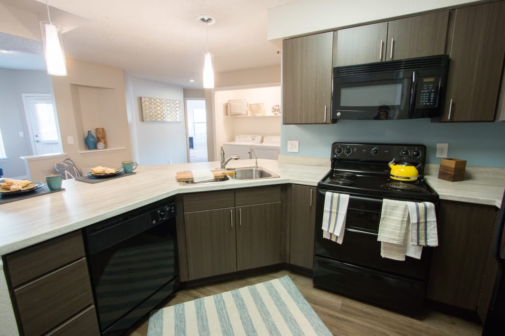 Spacious kitchen with ample cabinet space and granite countertops at Ashford Belmar in Lakewood, Colorado