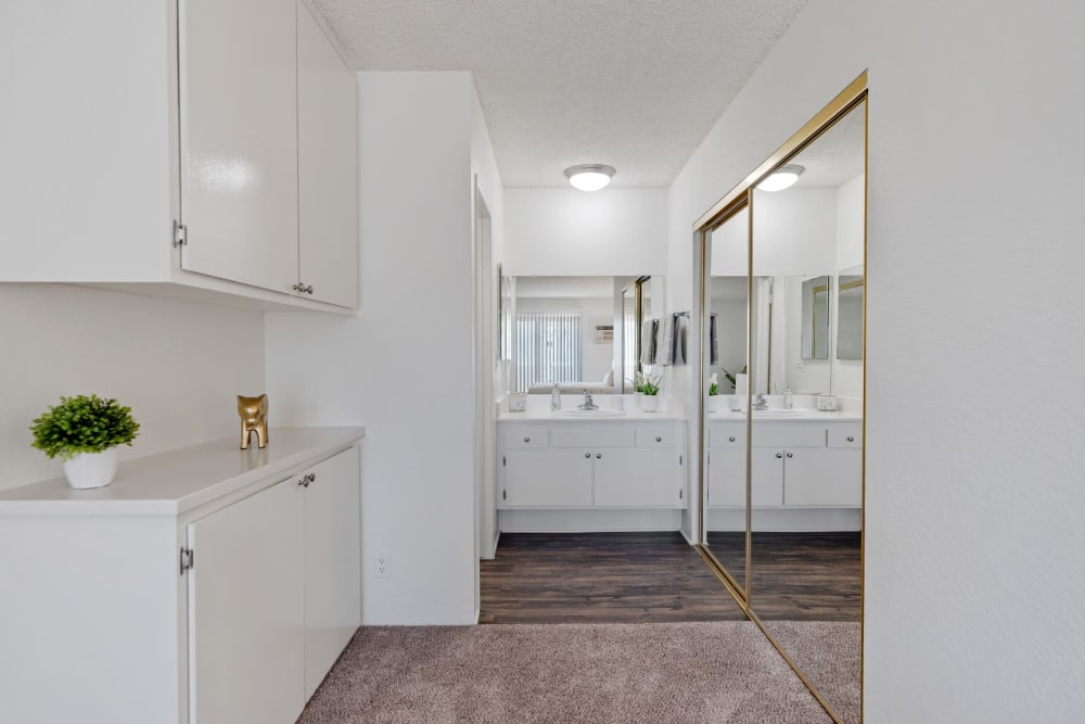 Master bathroom with mirrored closet doors at The Terrace in Tarzana, CA