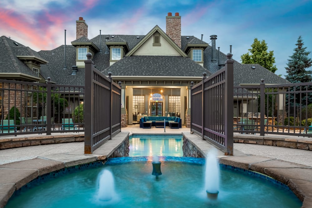 Pool with small fountains facing the clubhouse at Marquis at Town Centre in Broomfield, Colorado