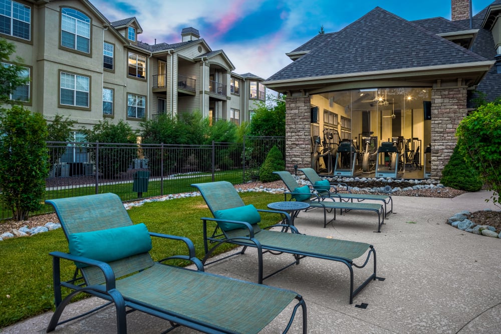 Lounge chairs poolside during sunset at Marquis at Town Centre in Broomfield, Colorado