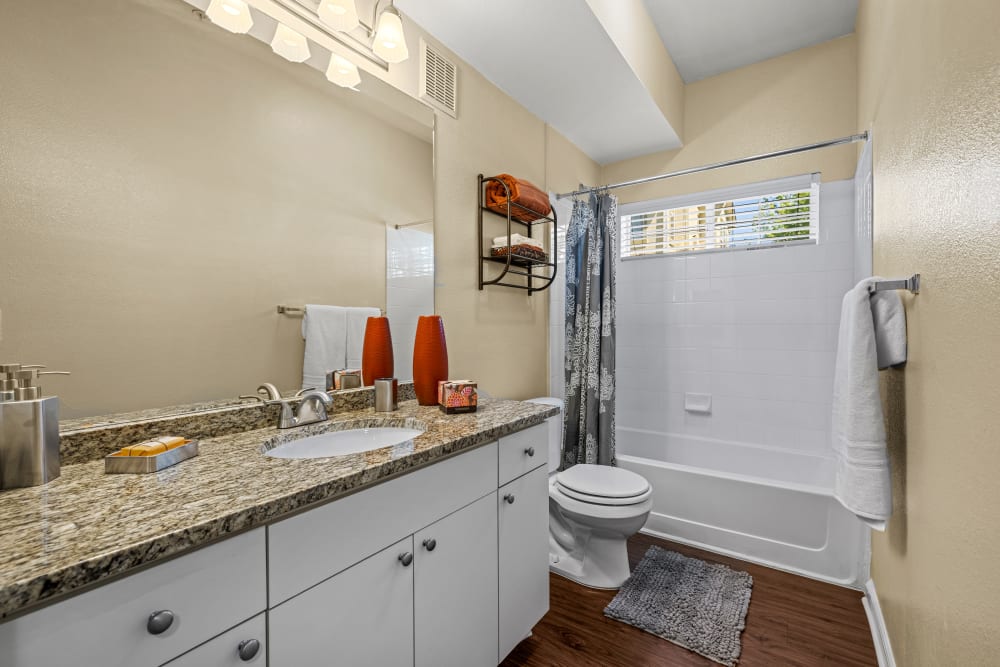 Bathroom with large vanity mirror at Marquis at Town Centre