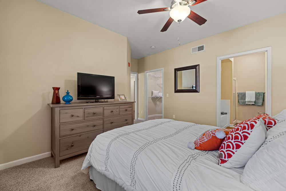 Decorated bedroom with ceiling fan at Marquis at Town Centre