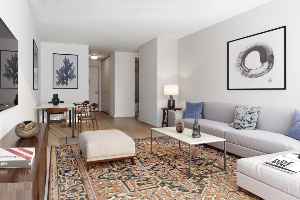 Gorgeous living room area with a large area rug in the center at The Ventura in New York, New York