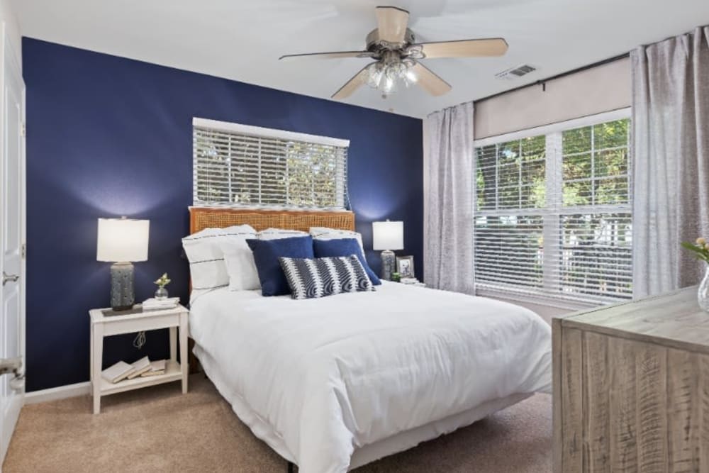 Bedroom with wooden floors and large windows at Marquis on Cary Parkway