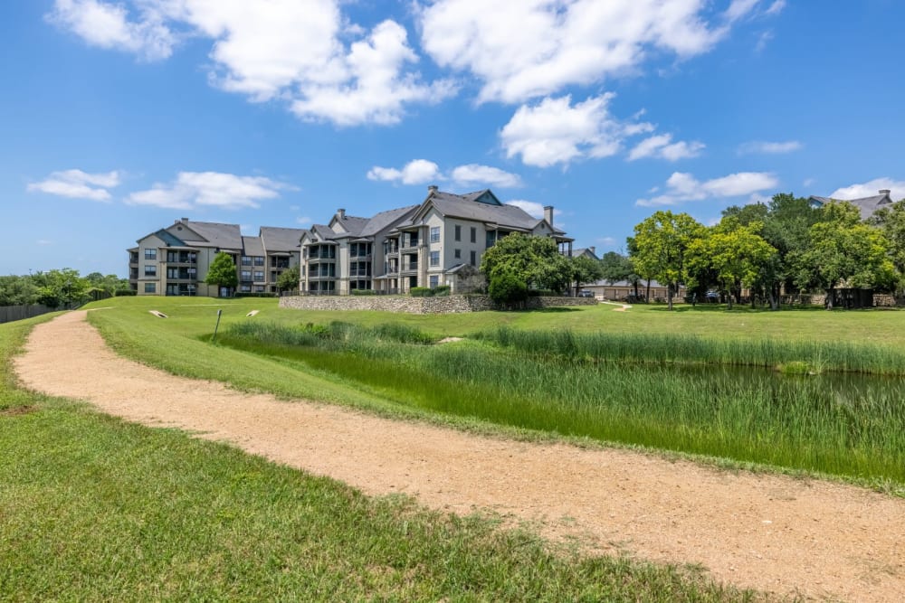 Walkways and plenty of green space outside at The Marquis at Brushy Creek