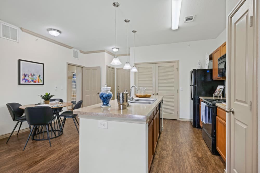 View of dining table from kitchen at The Marquis at Brushy Creek