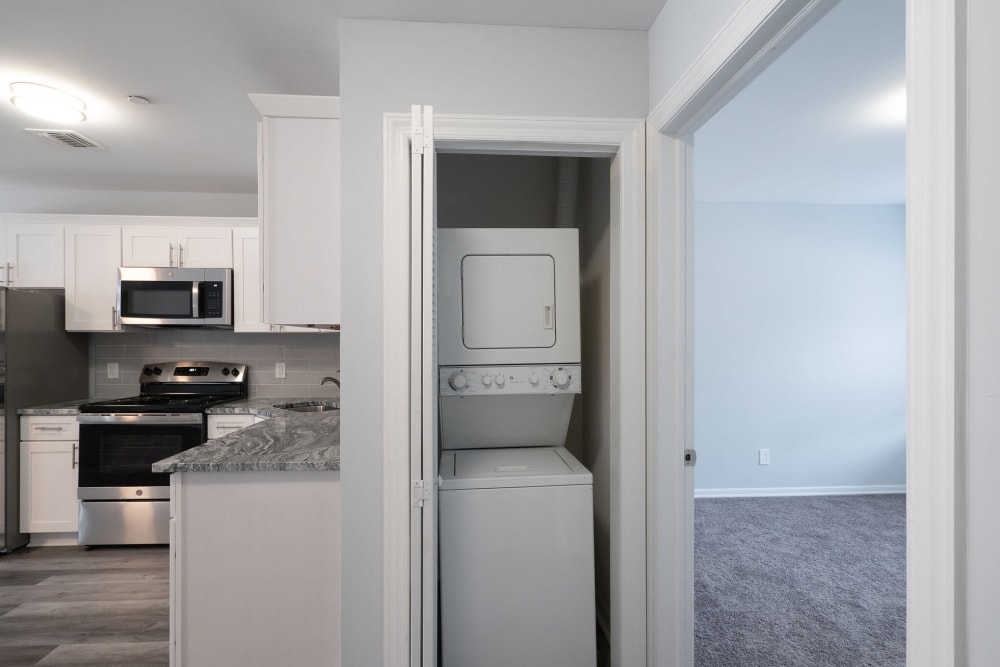 Kitchen with washer and dryer nearby at Bunt Commons II in Copiague, New York