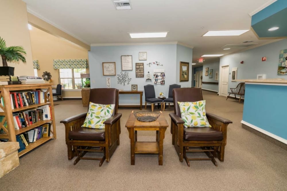 Sitting room with wood chairs at Lakeshore Assisted Living and Memory Care in Rockwall, Texas