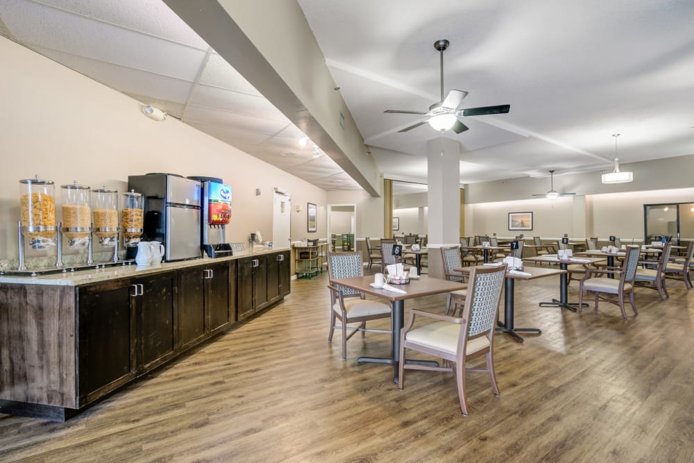 Drink station and dining room area at Truewood by Merrill, Port Charlotte in Port Charlotte, Florida.