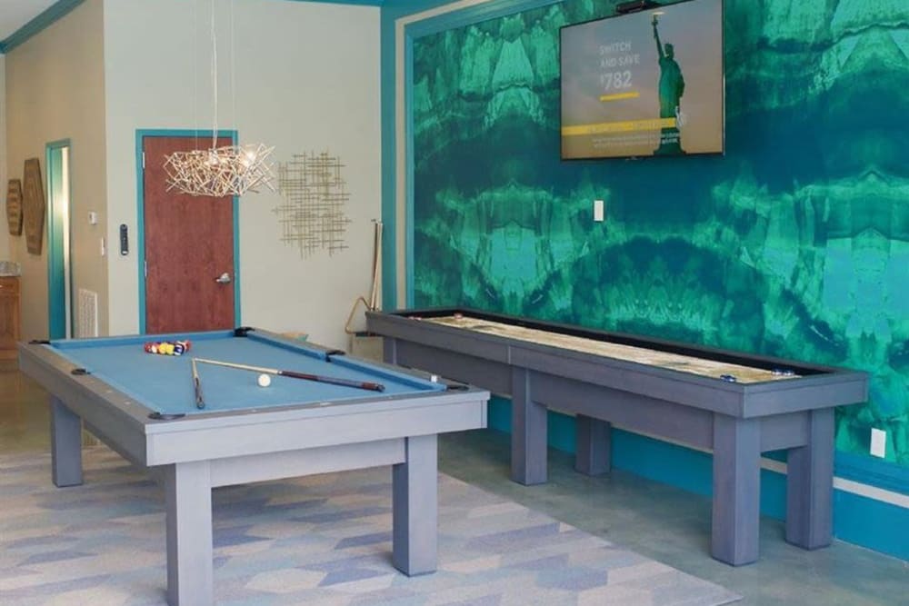 Game room with pool and shuffleboard at Encore North in Greensboro, North Carolina