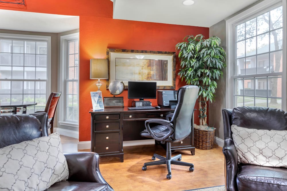 A home office setup off of the living room and dining area in a model apartment at Foundations at Austin Colony in Sugar Land, Texas