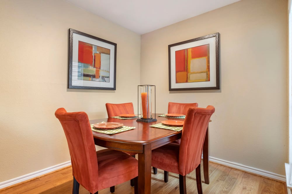 Dining area with hardwood floors in a model apartment home at Foundations at Austin Colony in Sugar Land, Texas