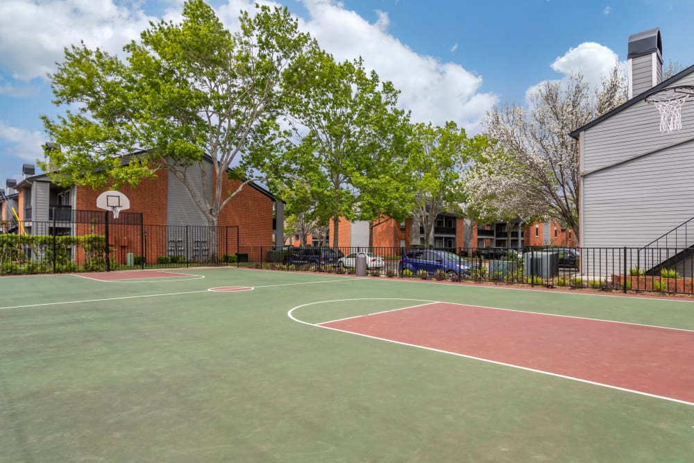 Fenced full size basketball court at Foundations at Austin Colony in Sugar Land, Texas