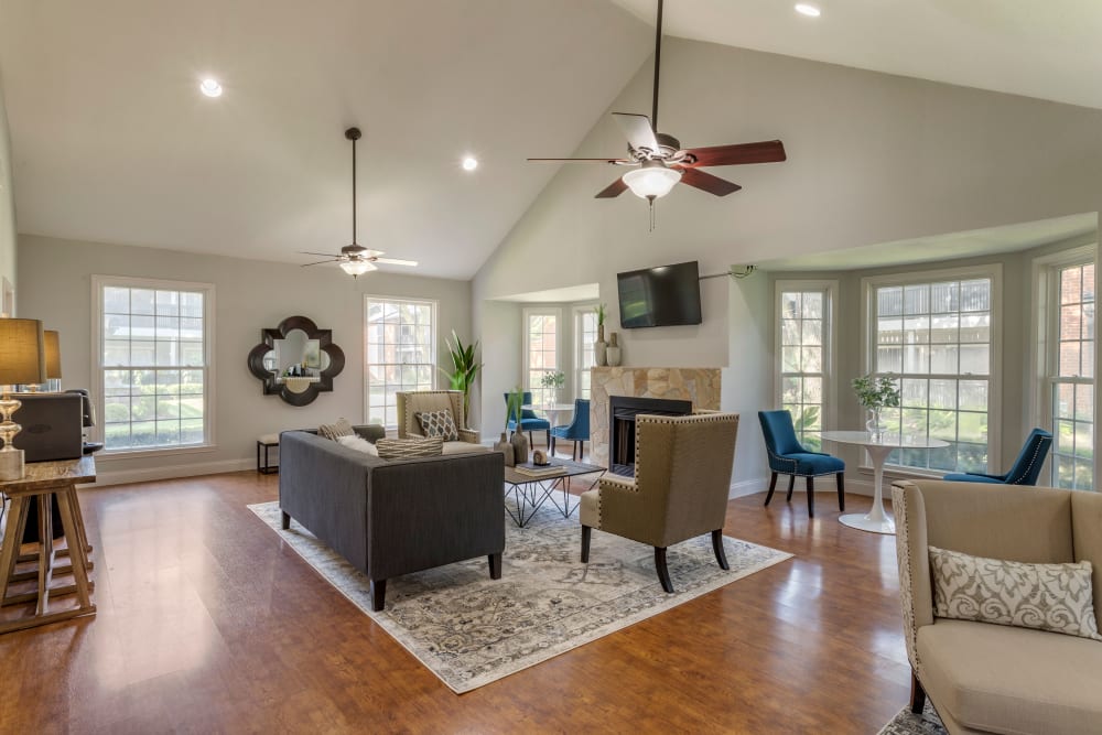 Well decorated resident clubhouse with a variety of comfortable seating areas at Foundations at Austin Colony in Sugar Land, Texas