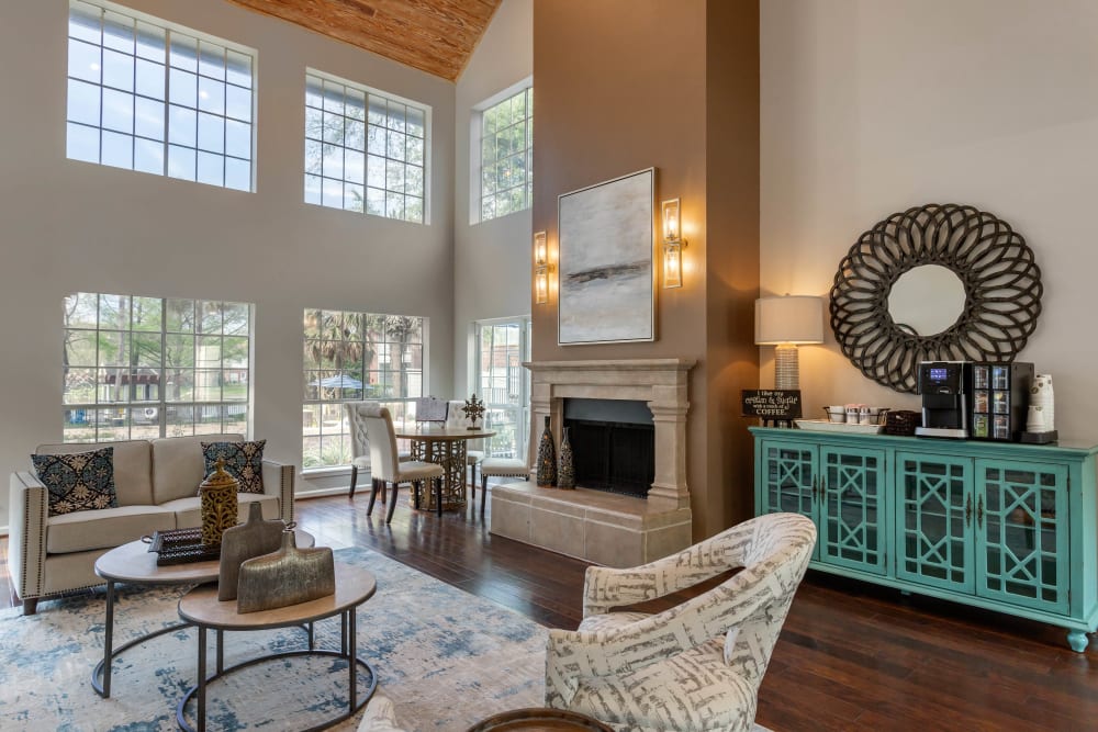 Well decorated resident clubhouse with lots of windows and soaring vaulted ceilings at Foundations at Edgewater in Sugar Land, Texas