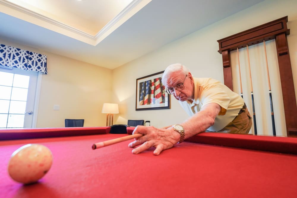 Resident playing pool Harmony at Victory Station in Murfreesboro, Tennessee