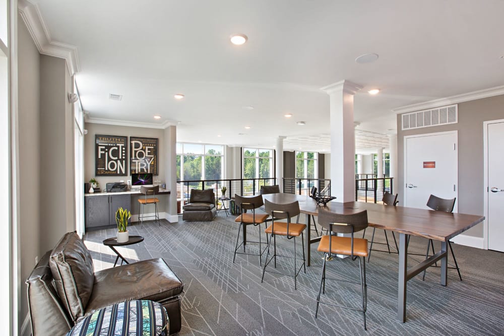 Clubhouse area with tons of seating and tables to work at at 8 Metro Station in Charlotte, North Carolina