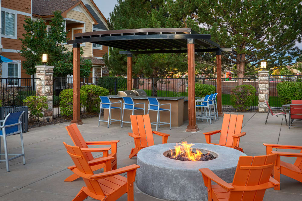 A grilling area by the pool at Crestone Apartments in Aurora, Colorado