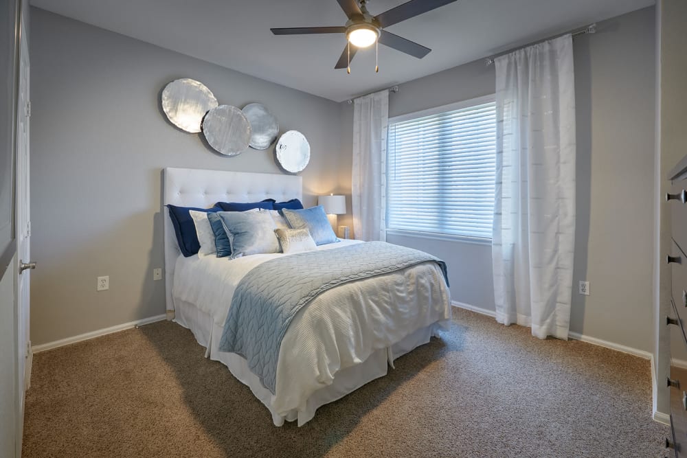 A bright bedroom at Crestone Apartments in Aurora, Colorado