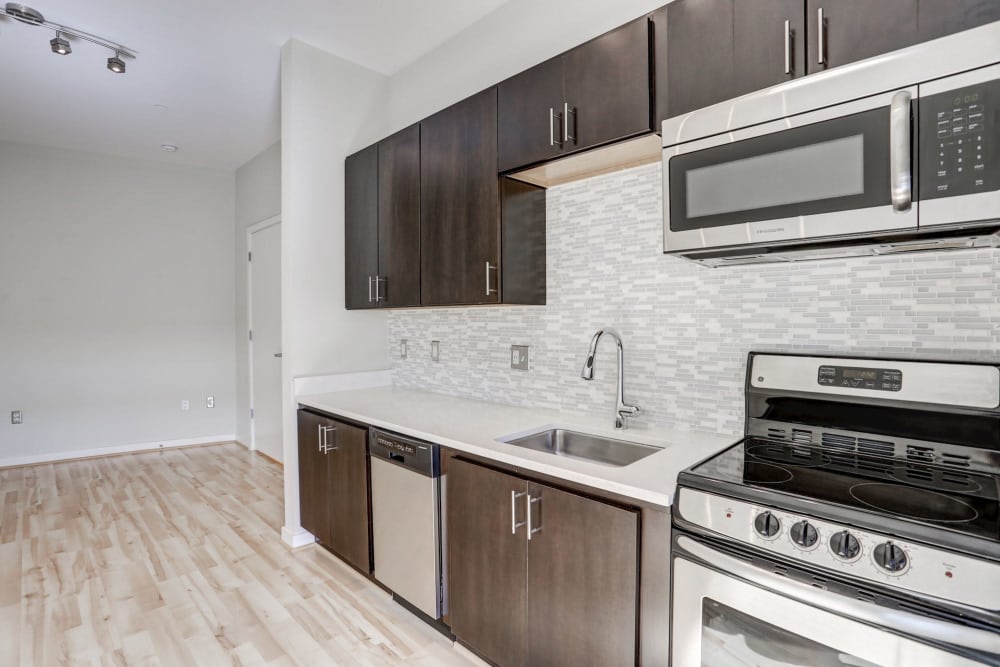 Sleek looking kitchen with stainless steel appliances at 1350 Florida in Washington, District of Columbia