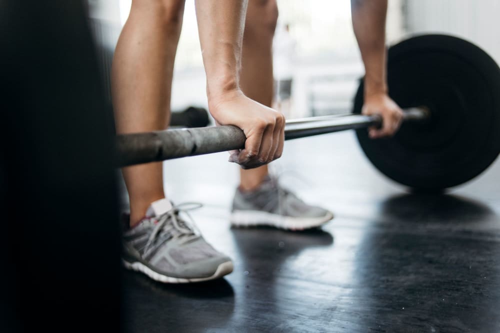 Lifting weights at the fitness center at 1630 R St NW in Washington, District of Columbia