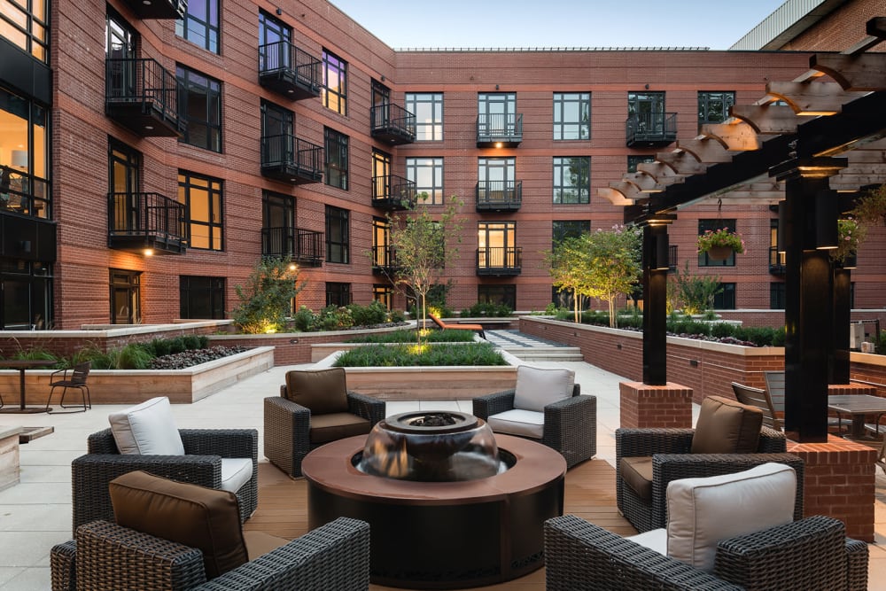 Outdoor courtyard area with a circular firepit with lots of seats at 700 Constitution in Washington, District of Columbia