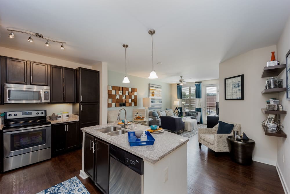 Bright kitchen with an island at Lane Parke Apartments in Mountain Brook, Alabama
