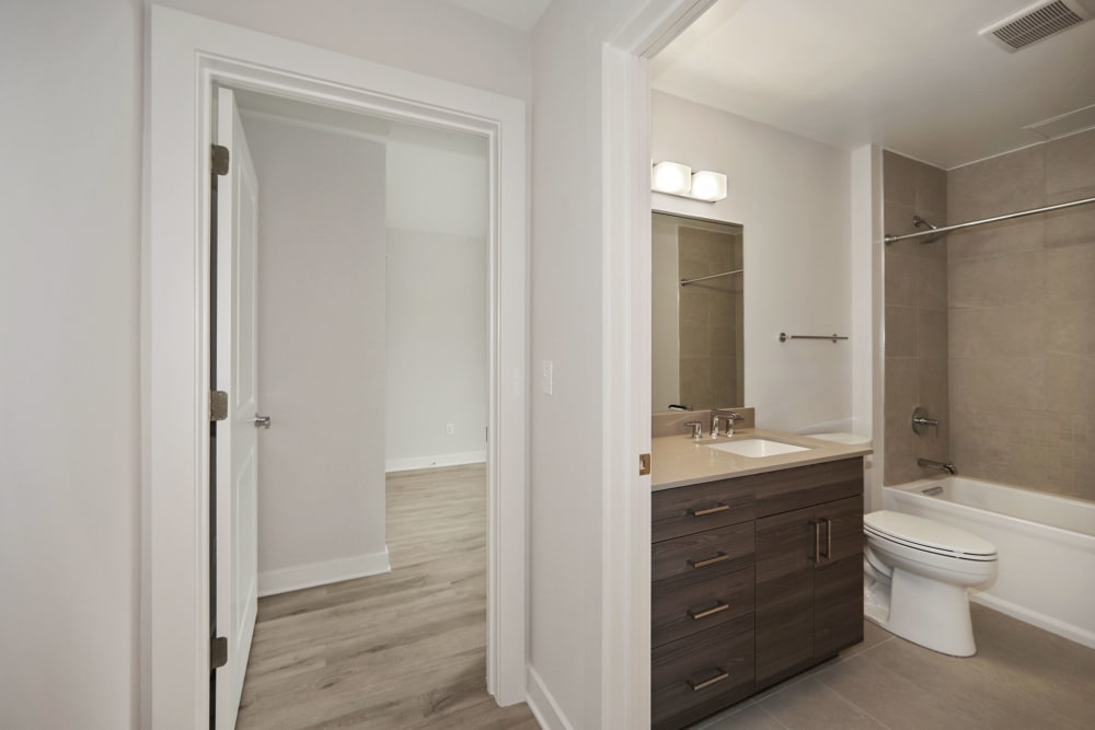Bathroom with cute vanity and shower at Madrona Apartments in Washington, District of Columbia
